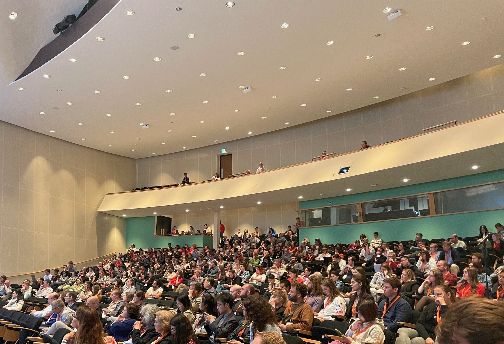 Audience seated in auditorium during European Congress on Biotechnology conference session