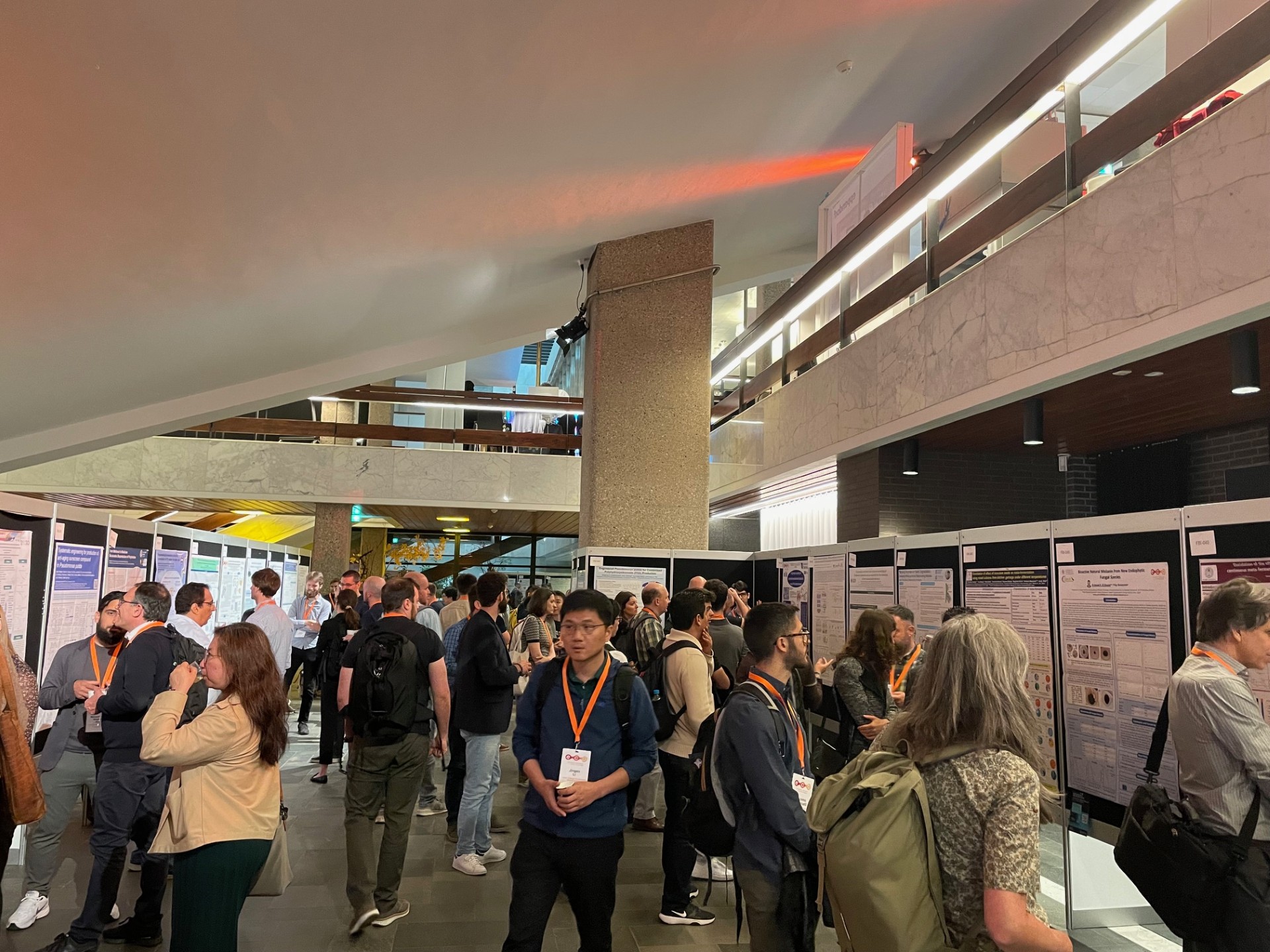 Participants networking and discussing posters during exhibition session at European Congress on Biotechnology