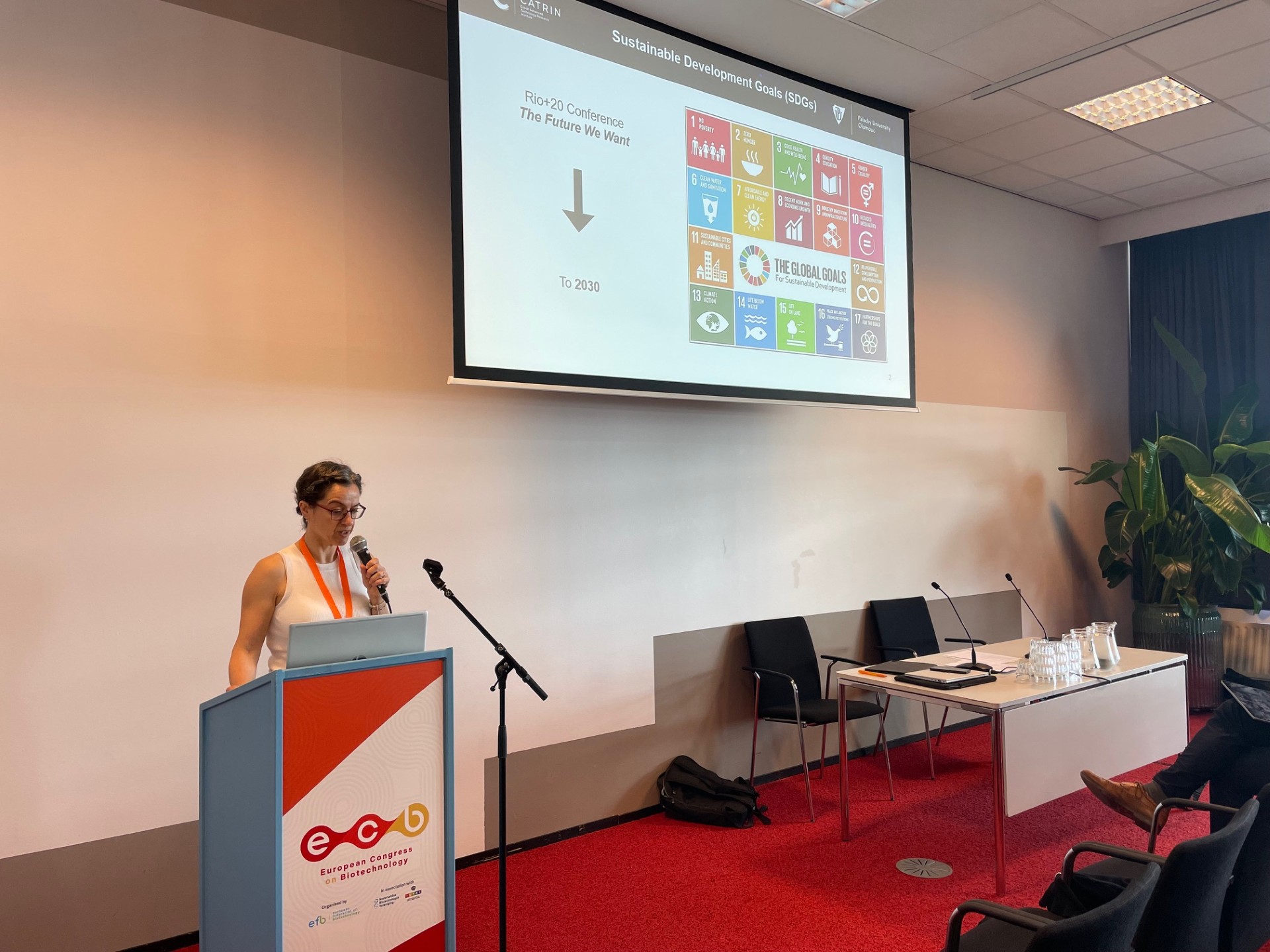 Speaker presenting sustainability topics in breakout session at European Congress on Biotechnology